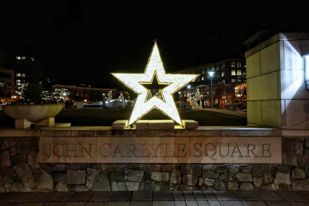 Illuminated star sculpture at Carlyle Square at night