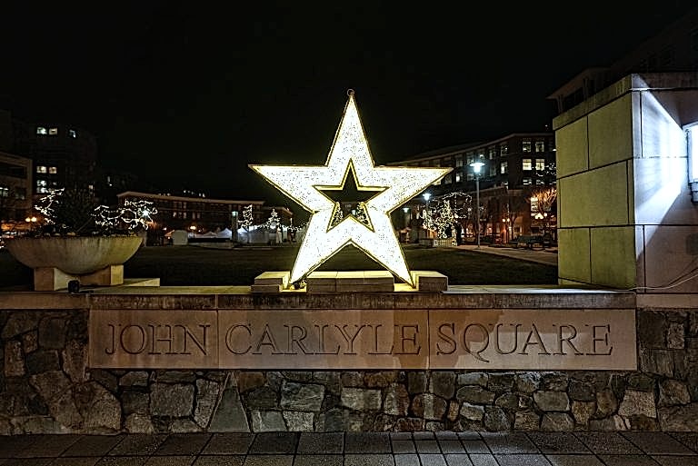 Illuminated star sculpture at Carlyle Square at night