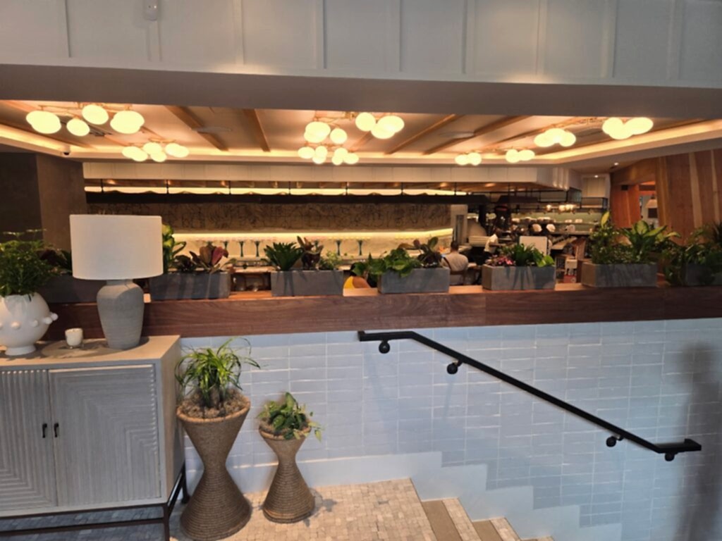 Plants in lobby planters beside a staircase